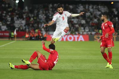 United Arab Emirates' midfielder Bandar Mohammed jumps over Bahrain's defender Ahmed Ali Juma. AFP