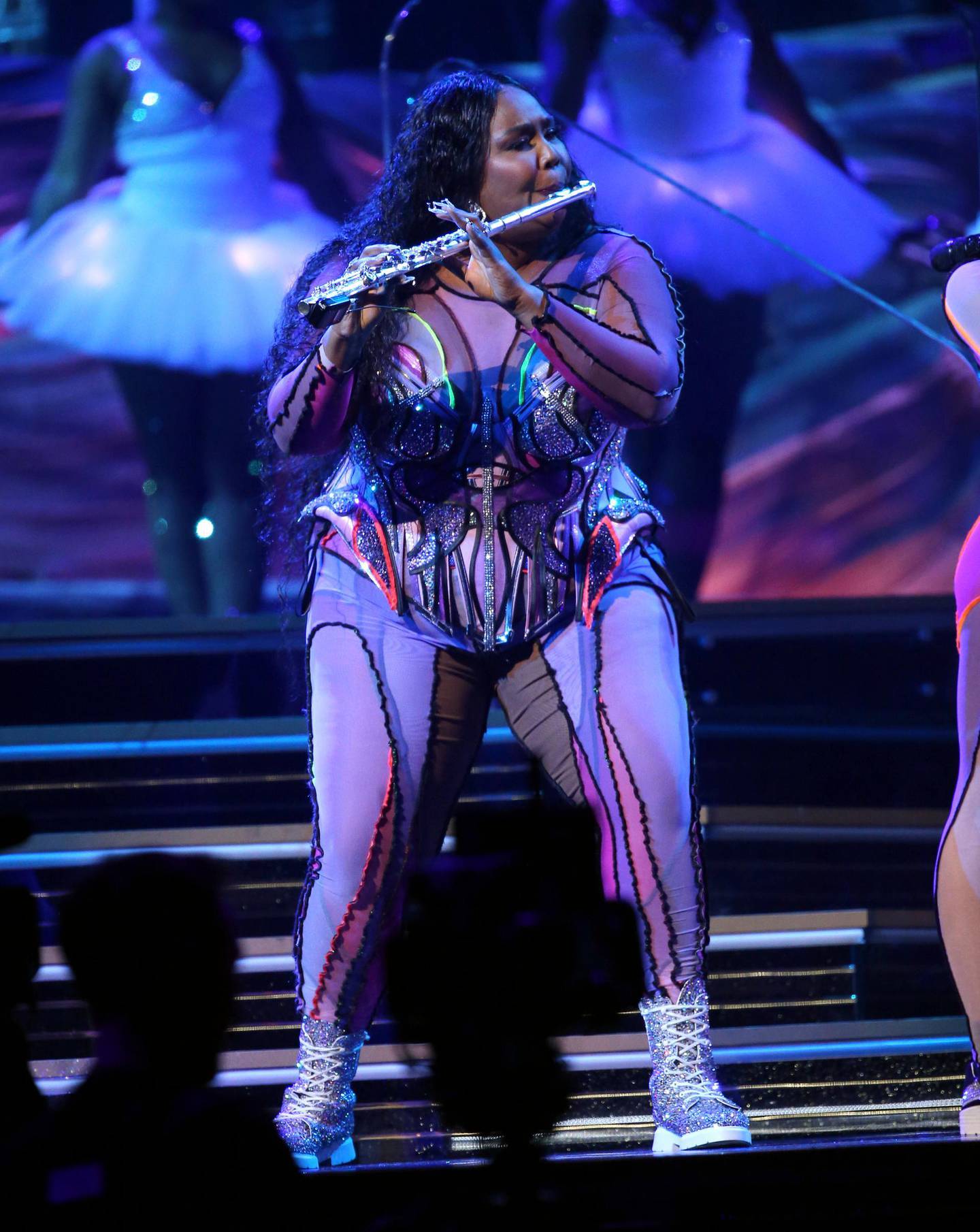 Lizzo plays the flute during her performance at the 62nd annual Grammy Awards on Sunday, Jan. 26, 2020, in Los Angeles. (Photo by Matt Sayles/Invision/AP)