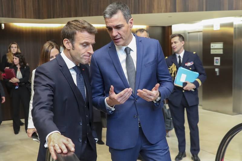 French President, Emmanuel Macron, left, and Spanish Prime Minister, Pedro Sanchez chat before a joint press conference on the pipeline. EPA