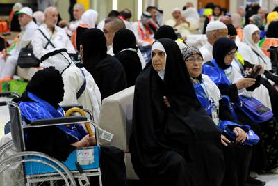 Muslim pilgrims wait at the airport in Baghdad on May 30, 2023 before leaving for the annual Hajj pilgrimage in the holy city of Mecca.  (Photo by Murtaja LATEEF  /  AFP)
