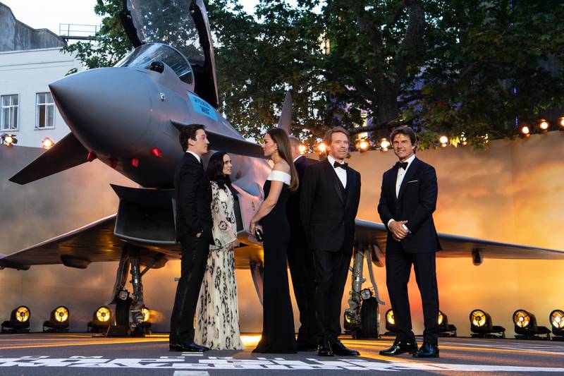 'Top Gun: Maverick' cast members Miles Teller, Jennifer Connelly and Tom Cruise, and producer Jerry Bruckheimer, talk to the Duke and Duchess of Cambridge. Getty Images 