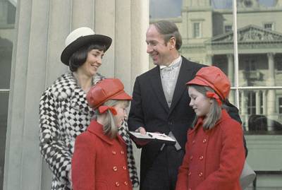 Bobby Charlton, surrounded by his family, receives a medal at Buckingham Palace. AP