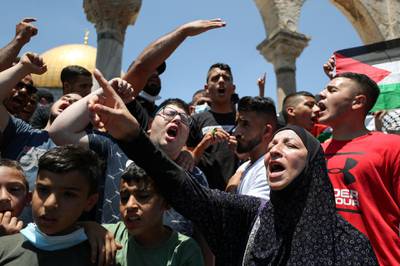 Demonstrators protest over the death of Nizar Banat at the Al Aqsa mosque compound after Friday prayers on June 25, 2021. Reuters