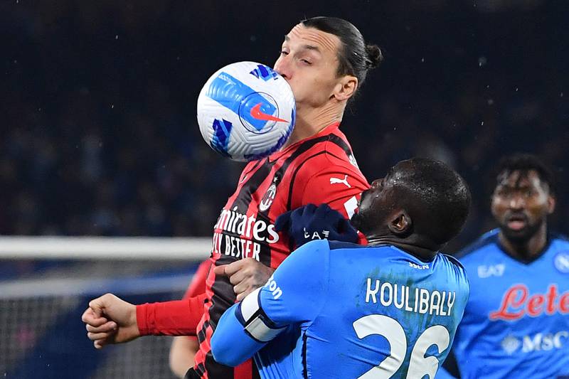 AC Milan's Swedish forward Zlatan Ibrahimovic fights for the ball with Napoli's Senegalese defender Kalidou Koulibaly. AFP