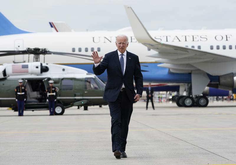 Joe Biden waves as he crosses the tarmac next to Air Force One at Munich International Airport. The US president is leaving Germany on his way to Spain to attend a Nato summit. AP
