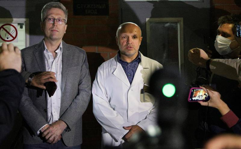 Anatoly Kalinichenko, deputy chief doctor of the Omsk Ambulance Hospital No. 1, right, and Boris Teplykh, head of the department of anaesthesiology and resuscitation of the Pirogov's medical centre, speak to the media at the intensive care unit where Alexei Navalny was hospitalised. AP