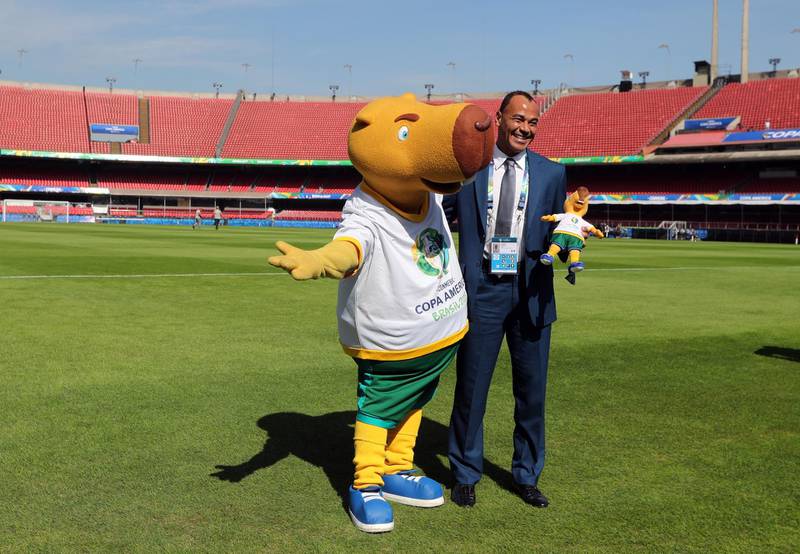 The mascot of Copa America 2019 tournament Zizito poses with former Brazil captain Cafu. EPA