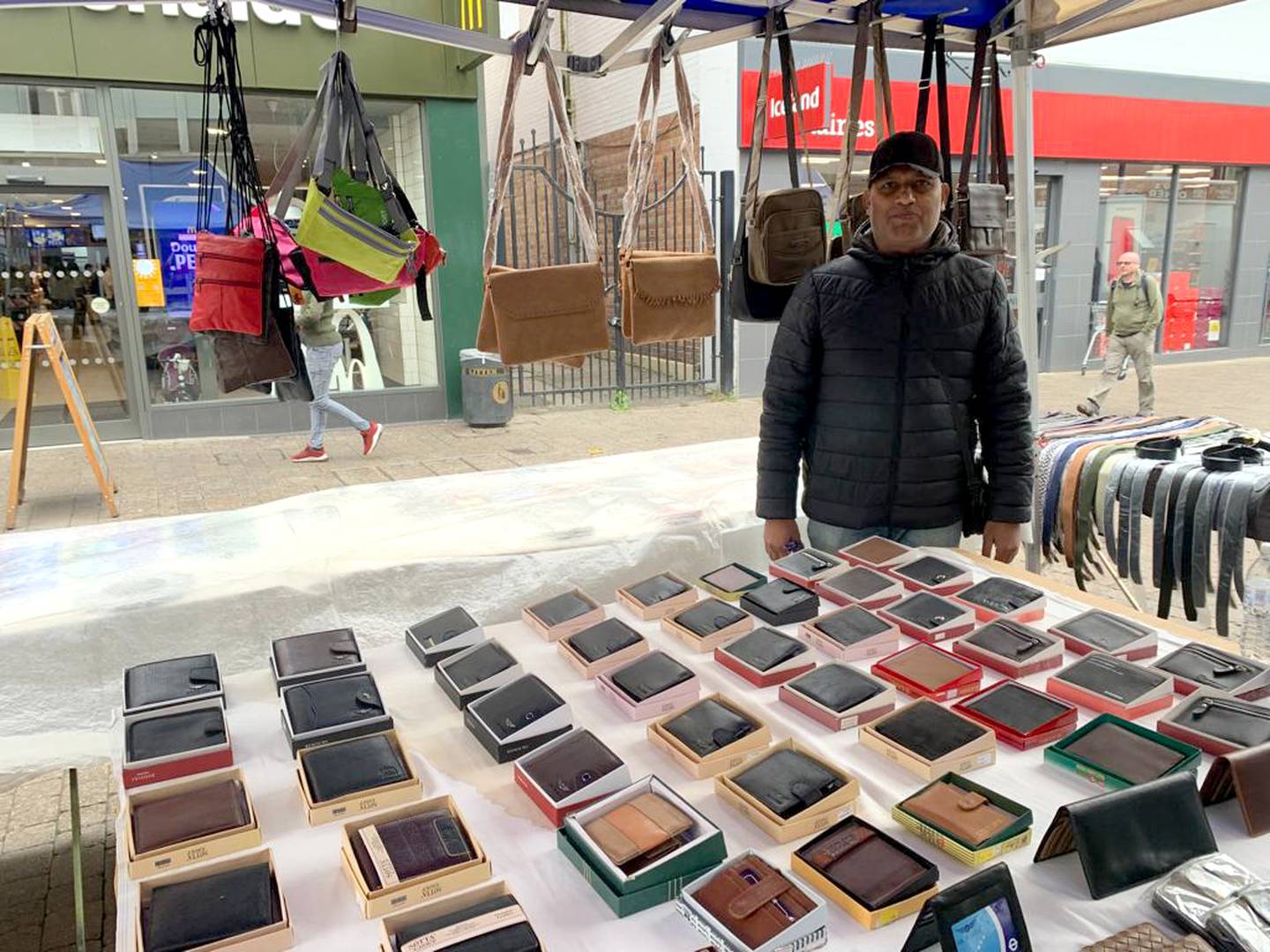 Staines stallholder Ali Ahmed said he was more concerned about the cost-of living crisis than his MP's departure. Laura O’Callaghan / The National