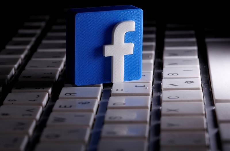 FILE PHOTO: A 3D-printed Facebook logo is seen placed on a keyboard in this illustration taken March 25, 2020. REUTERS/Dado Ruvic/Illustration/File Photo  GLOBAL BUSINESS WEEK AHEAD