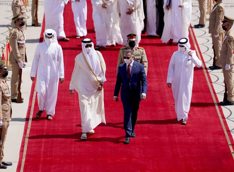 Iraqi Prime Minister Mustafa Al Kadhimi receives Qatar’s Emir Sheikh Tamim. AFP