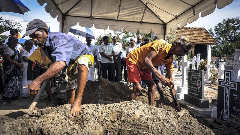 Grave diggers bury a victim of the suicide bomb attacks in Negombo, Sri Lanka, April 23, 2019. Jack Moore / The National. 