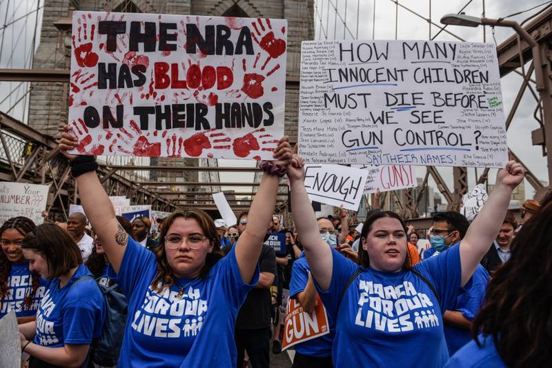 Demonstrators cross the Brooklyn Bridge during the March For Our Lives rally in New York, where anger was focused on America's National Rifle Association. Bloomberg