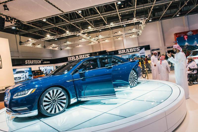A man photographs a Lincoln Continental on the opening night of the Dubai International Motor Show. Alex Atack for The National