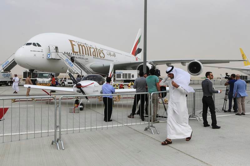 DUBAI, November 17, 2013 - Guests walk by the Emirates Airbus A380-800 plane at the Dubai Air Show in Dubai, November 17, 2013.  (Photo by: Sarah Dea/The National, Story by: Lianne Gutcher, Business) *** Local Caption ***  SDEA171113-dubai_airshow_lianne22.JPG