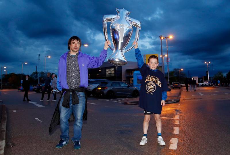 Manchester City fans celebrate winning the Premier League. Reuters