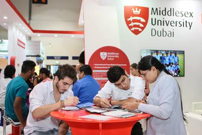 DUBAI, UAE. April 14, 2015 - Students learn more about Middlesex University Dubai during GETEX, aka the Gulf Education and Training Exhibition 2015 at Dubai International Convention and Exhibition Centre in Dubai, April 14, 2015. (Photos by: Sarah Dea/The National, Story by: Nadeem Hanif, News
 *** Local Caption ***  SDEA150415-educationexpo09.JPG