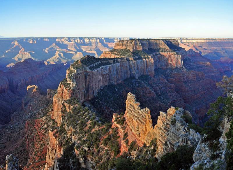Cape Royal on the North Rim provides a panorama up, down, and across the canyon. With seemingly unlimited vistas to the east and west, it is popular for both sunrise and sunset. The sweeping turn of the Colorado River at Unkar Delta is framed through the natural arch of Angels Window. Look for the Desert View Watchtower across the canyon on the South Rim. This popular viewpoint is accessible via a paved, level trail. Cape Royal and Point Imperial are reached via a winding scenic drive. The trip to both points, with short walks at each and several stops at pullouts along the way, can easily take half a day. Lodging and food service facilities on the North Rim of Grand Canyon National Park are open for the summer season between May 15 and October 15 of each year. Grand Canyon Lodge North Rim, a Forever Resorts property, and Grand Canyon Trail Rides operate during this 5 month period. For more information visit: http://www.nps.gov/grca/planyourvisit/directions_n_rim.htmNPS Photo by Michael Quinn