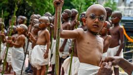 Indian children dress up as Mahatma Gandhi