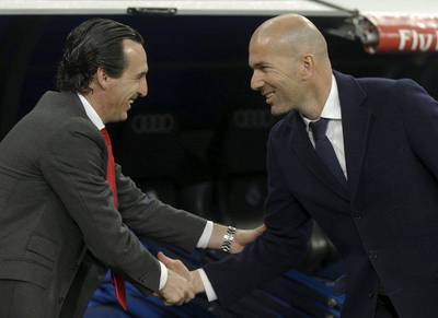 Real Madrid’s coach Zinedine Zidane greets Sevilla’s coach Unai Emery before match. REUTERS/Sergio Perez