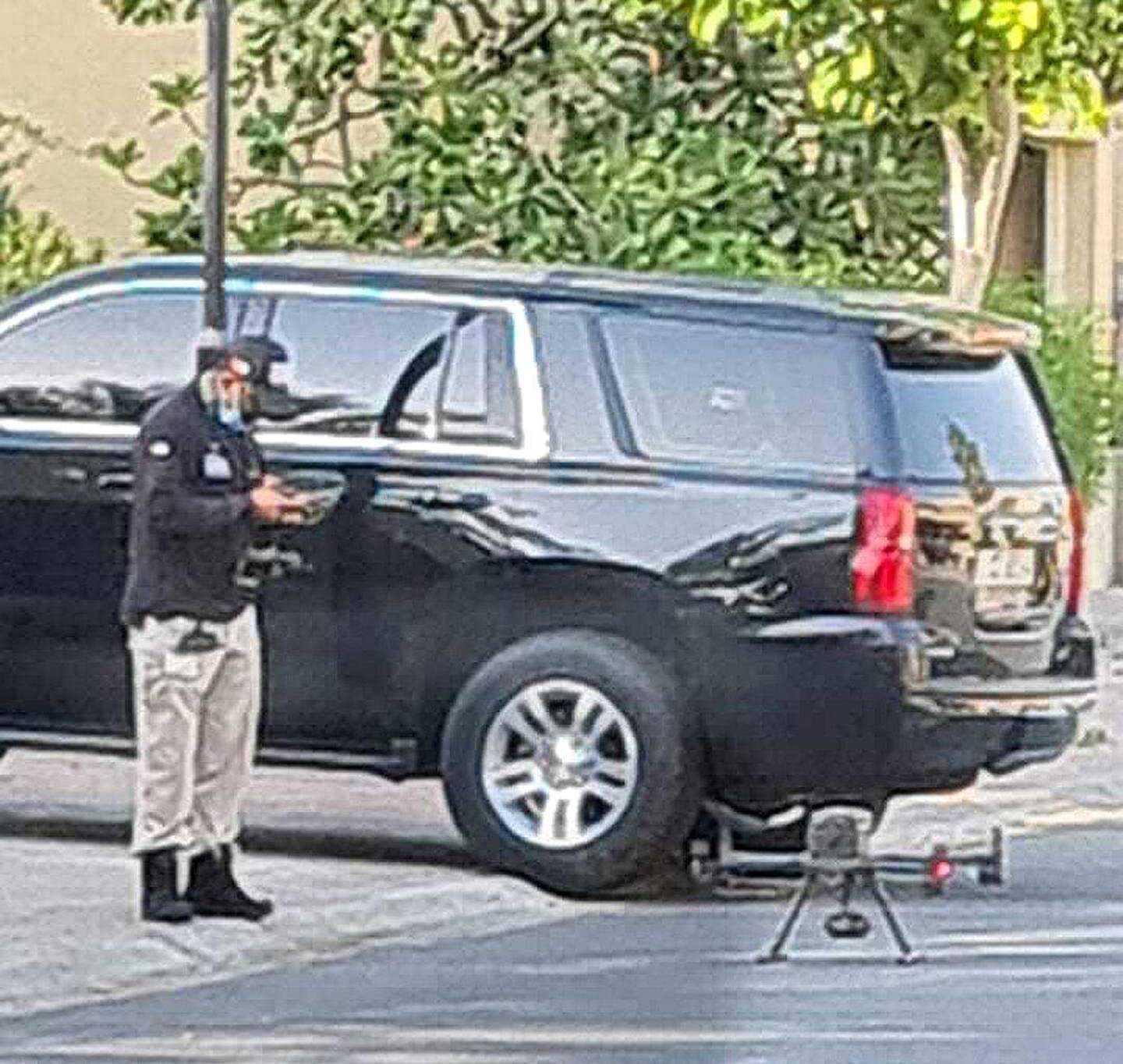 A police official prepares to launch an aerial drone to scan the Springs district, south of Dubai Marina, following reports of a big cat on the loose. Authorities urged the public to call 999 if they spot a creature that resembles a large black cat. The National