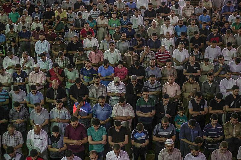 Palestinians pray at the al-Omari mosque during Laylat Al Qadr in Gaza City, on June 12, 2018. Mohammed Saber / EPA