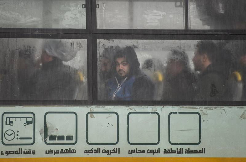 A man looks from a bus window during a thunderstorm and heavy rains in Cairo. EPA