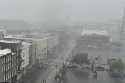 Rain batters Canal Street in New Orleans. AFP