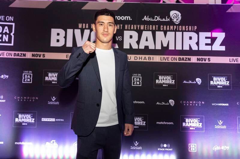 Dimitry Bivol poses for photos after arriving for the launch party.