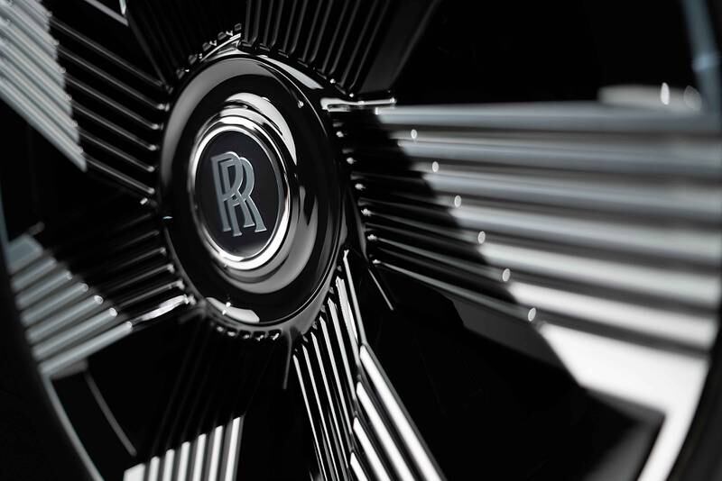 The Rolls-Royce symbol on the Spectre's wheels.