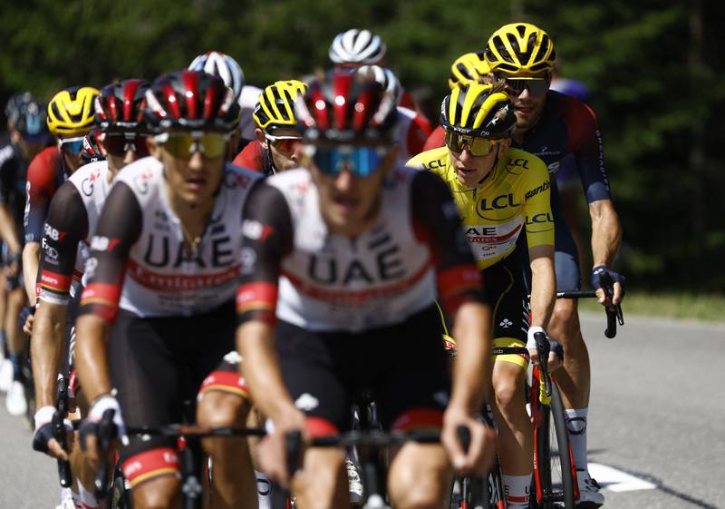 UAE Team Emirates' Tadej Pogacar wearing the overall leader's yellow jersey. Reuters