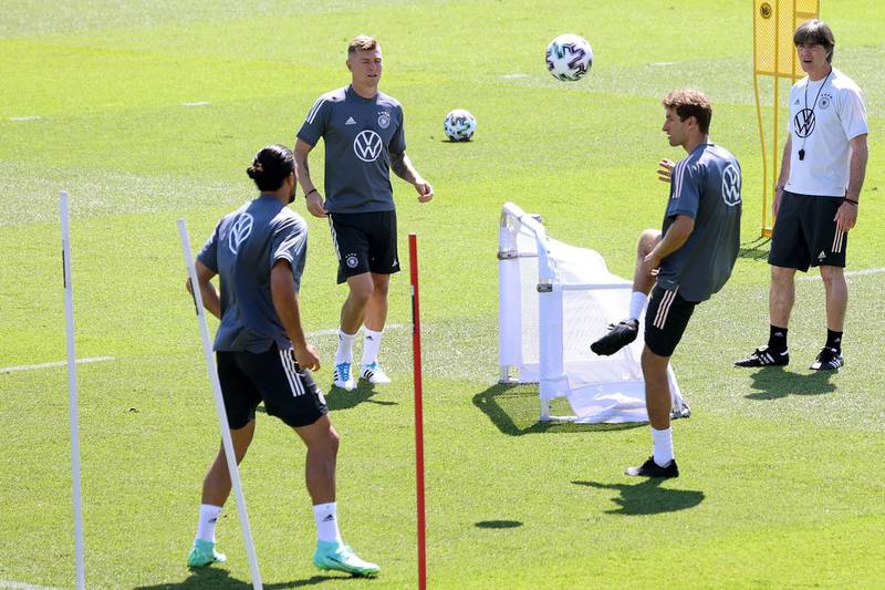 Left to right: Emre Can, Toni Kroos, Thomas Müller and Joachim Low. Getty