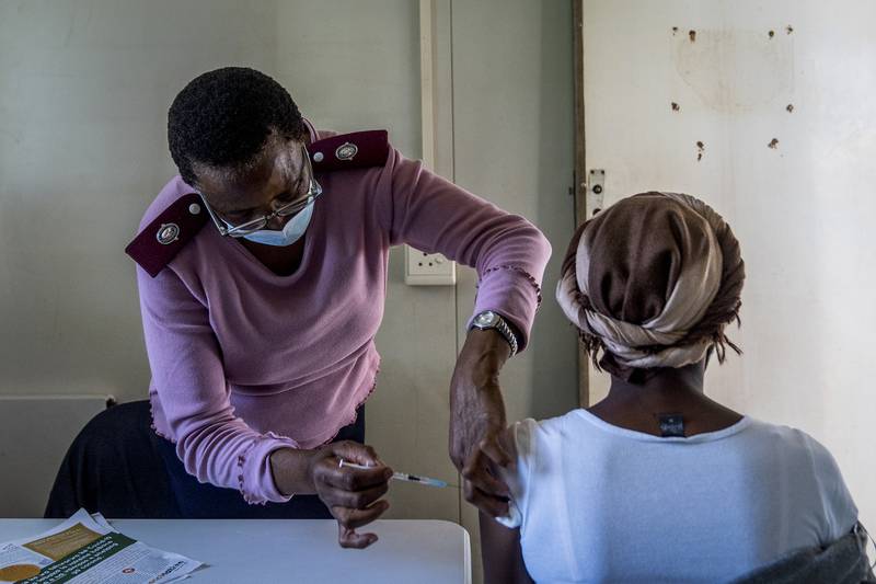 A woman is vaccinated against Covid-19 in Lawley, south of Johannesburg. AP