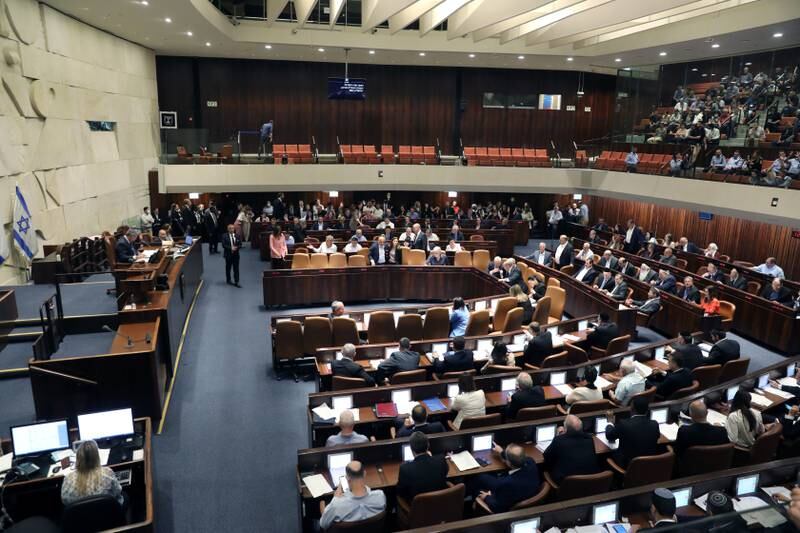 Knesset members vote on dissolving the government last week. EPA