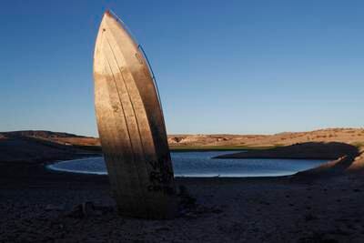 A formerly sunken boat sits upright on the shore of Lake Mead, Nevada, where water levels have dropped. EPA