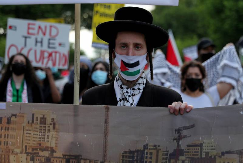 Pro-Palestinian demonstrators march in a protest titled “Stop Jerusalem Expulsions, save Sheikh Jarrah”, from the US State Department to the White House area, in Washington. Reuters
