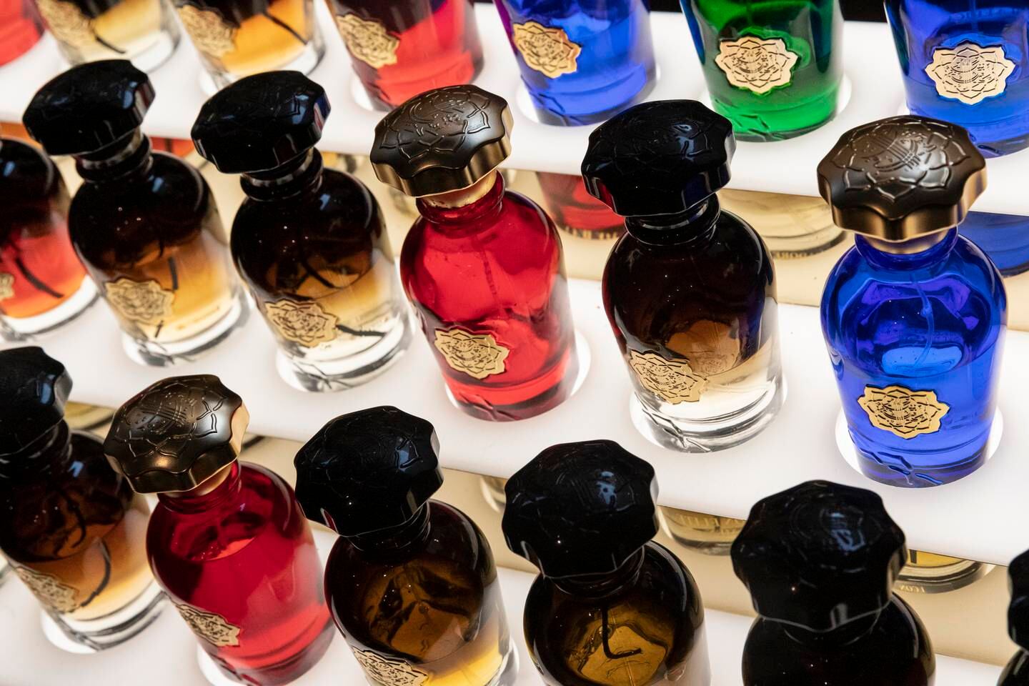 Fragrance bottles lined up at Al Bait Dimashqi Perfumes. Antonie Robertson / The National
