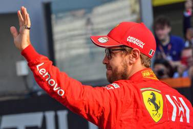 (FILES) In this file photo taken on December 1, 2019 Ferrari's German driver Sebastian Vettel waves at the Yas Marina Circuit in Abu Dhabi, ahead of the final race of the Formula One Grand Prix season. Vettel will leave Ferrari at the end of the 2020 season, AFP reports on May 12, 2020. / AFP / GIUSEPPE CACACE