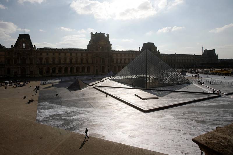 epa07471503 A general view of the 160,000-square-foot paper image by French photographer and artist Jean Rene, known as JR, at the pyramids of the Louvre Museum in Paris, France, 29 March 2019. The artwork called 'The Secret of the Grand Pyramid' is part of celebrations for the 30th anniversary of the glass structure designed by Chinese-US architect Ieoh Ming Pei. The Louvre Pyramid was inaugurated on 29 March 1989.  EPA-EFE/YOAN VALAT