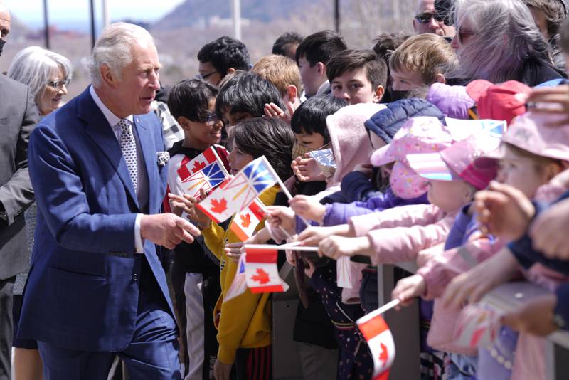 Prince Charles is greeted by well-wishers in St John's. AP