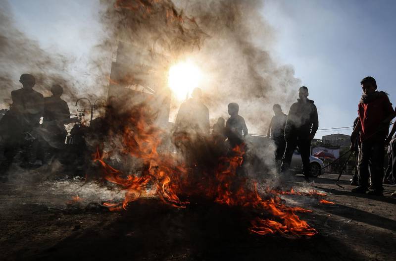 Palestinian demonstrators burn tyres during a protest against the US brokered Middle East peace plan, in Rafah in the southern Gaza Strip, on January 29, 2020. AFP