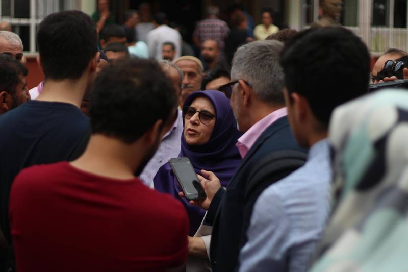 Huda Kaya, a HDP Member of Parliament standing for re-election, speaks to the press after casting her vote on Monday in Tarlabasi, a predominantly Kurdish neighbourhood of Istanbul. Pesha Magid / The National