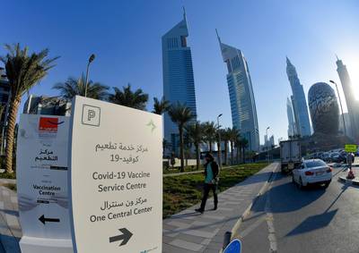 A panel indicates the way to a Covid-19 vaccination centre set up at Dubai International Financial Centre. AFP