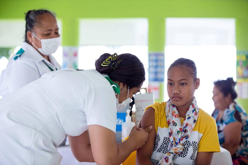 This handout picture taken on December 2, 2019 and released from UNICEF Samoa on December 4 shows a girl receiving a vaccine during a nationwide campaign against measles in the Samoan town of Le'auva'a. Authorities in Samoa asked unvaccinated families to display a red flag outside their homes on December 4 to help a mass immunisation drive aimed at halting a measles epidemic that has killed dozens of children. - ----EDITORS NOTE ----RESTRICTED TO EDITORIAL USE MANDATORY CREDIT " AFP PHOTO / ALLAN STEPHEN / UNICEF - NO MARKETING - NO ADVERTISING CAMPAIGNS - DISTRIBUTED AS A SERVICE TO CLIENTS - NO ARCHIVES
 / AFP / UNICEF / ALLAN STEPHEN / ----EDITORS NOTE ----RESTRICTED TO EDITORIAL USE MANDATORY CREDIT " AFP PHOTO / ALLAN STEPHEN / UNICEF - NO MARKETING - NO ADVERTISING CAMPAIGNS - DISTRIBUTED AS A SERVICE TO CLIENTS - NO ARCHIVES
