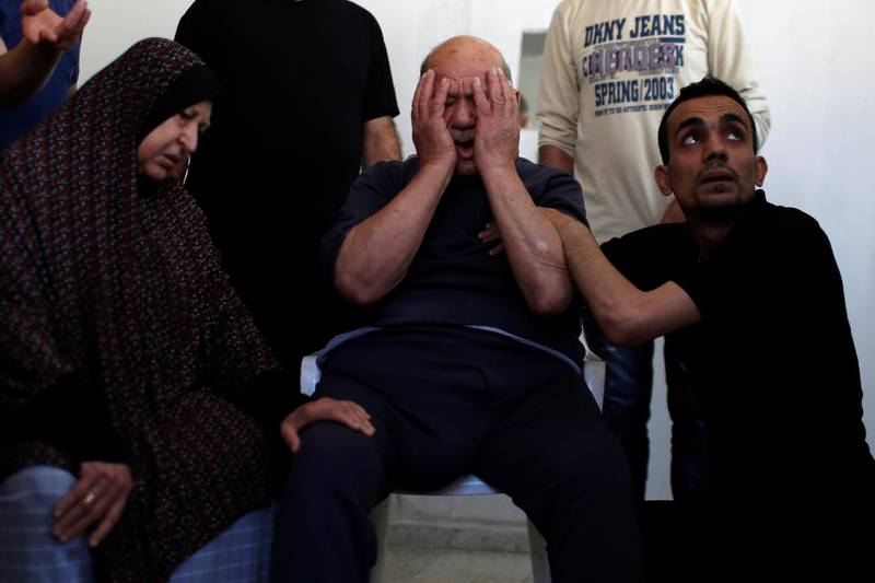 Parents of Palestinian man Abdulsalam Al-Ghazali, who was killed amid a flare-up of Israeli-Palestinian violence, react during their son funeral in Gaza City. Reuters