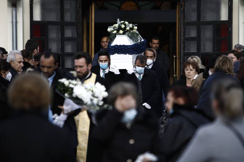 Pallbearers carry the coffin of one of the victims of the train crash, during a funeral procession, in Thessaloniki. AP