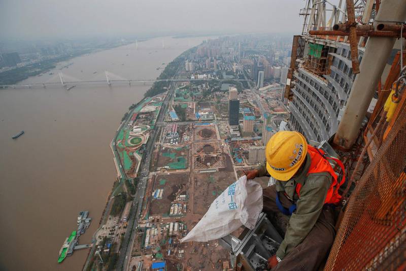 An employee working on the upper floors at the construction site of the Wuhan Greenland Centre in Wuhan in China's central Hubei province as the city continues its return to normality. AFP