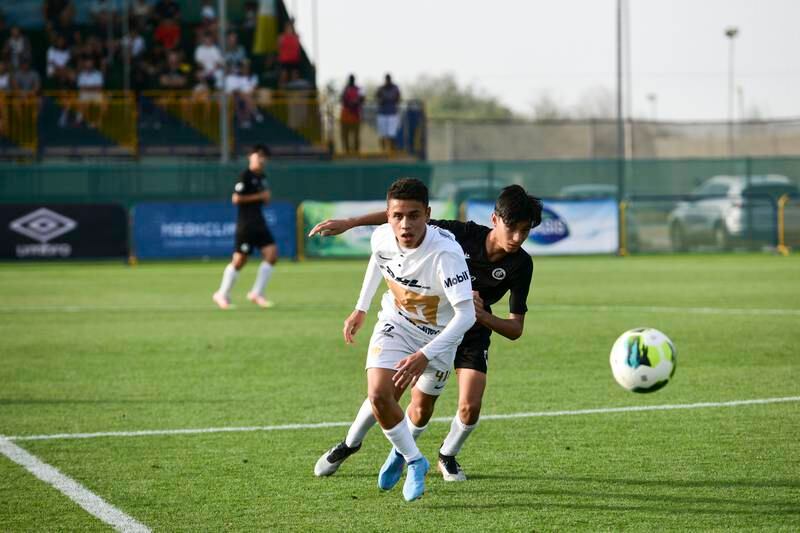 Dubai City in action against Pumas Unam at the Mina Cup 2022 youth football tournament being held in Jebel Ali, Dubai. All photos Khushnum Bhandari / The National
