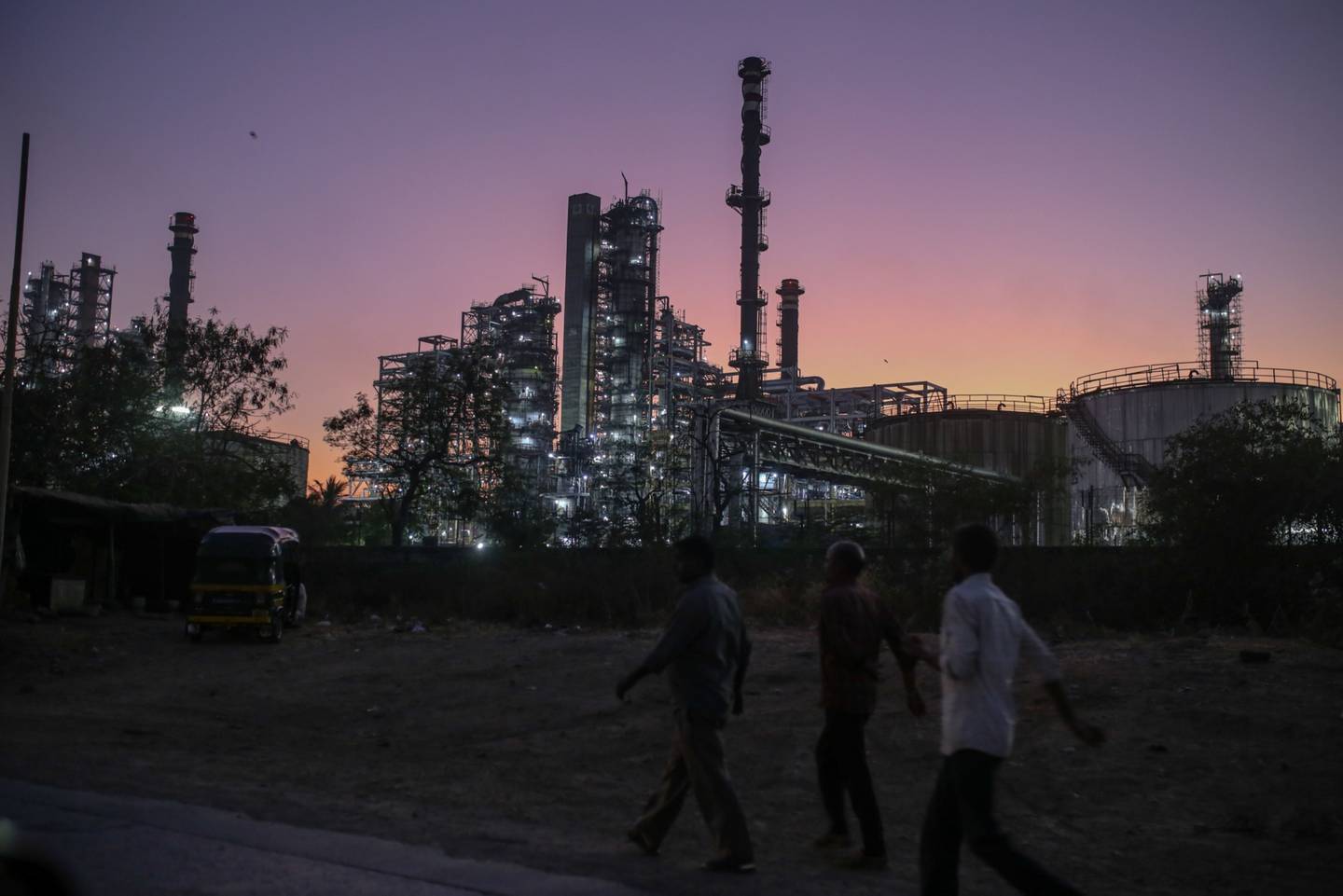 Pedestrians walk past an oil refinery, operated by Bharat Petroleum in Mumbai, India. The country remains of the key buyers of Russian crude.  Bloomberg