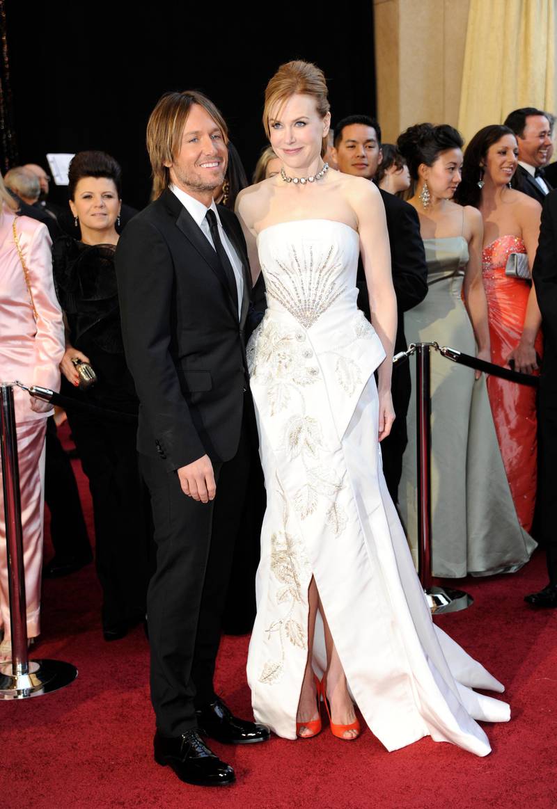 epa02606037 Australian actress Nicole Kidman (R) and husband, New Zealand country singer Keith Urban arrive for the 83rd annual Academy Awards at the Kodak Theatre in Hollywood, California, USA 27 February 2011. The Oscars are presented for outstanding individual or collective efforts in up to 25 categories in filmmaking.  EPA/MIKE NELSON