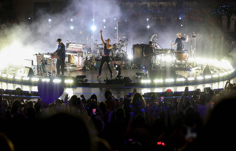 Thousands watch the Coldplay performance at Expo 2020 Dubai. Reuters 
